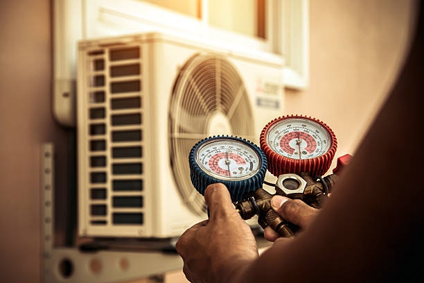Professional Air Conditioning Service technician working in Fountain Inn, SC